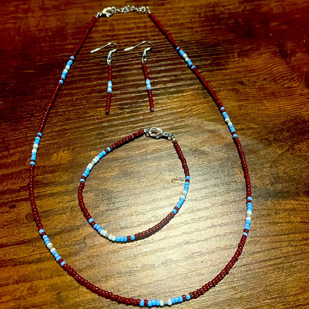 Blue and Maroon earrings necklace and bracelet.